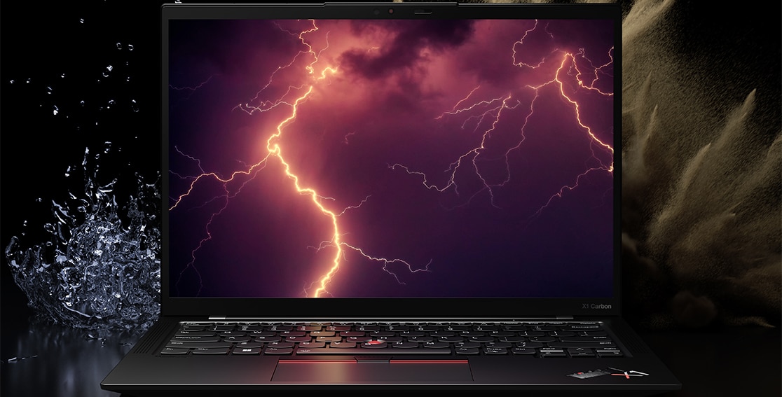 Lenovo ThinkPad X1 Carbon Gen 10 laptop surrounded by the elements of spilling water and desert dust, with lightning on the display to suggest MIL-SPEC testing. 