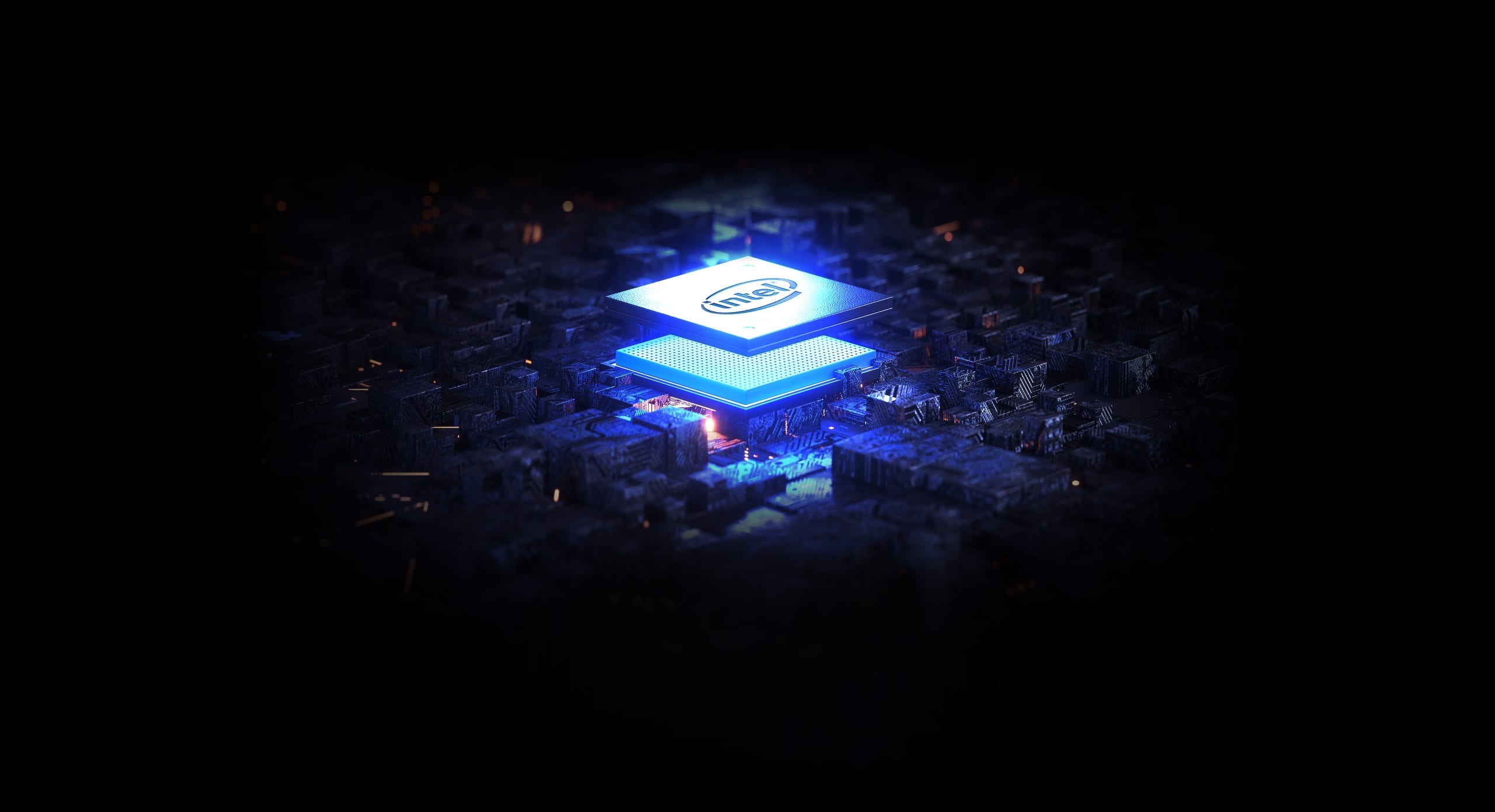 A glowing Intel CPU under blue and silver lighting.