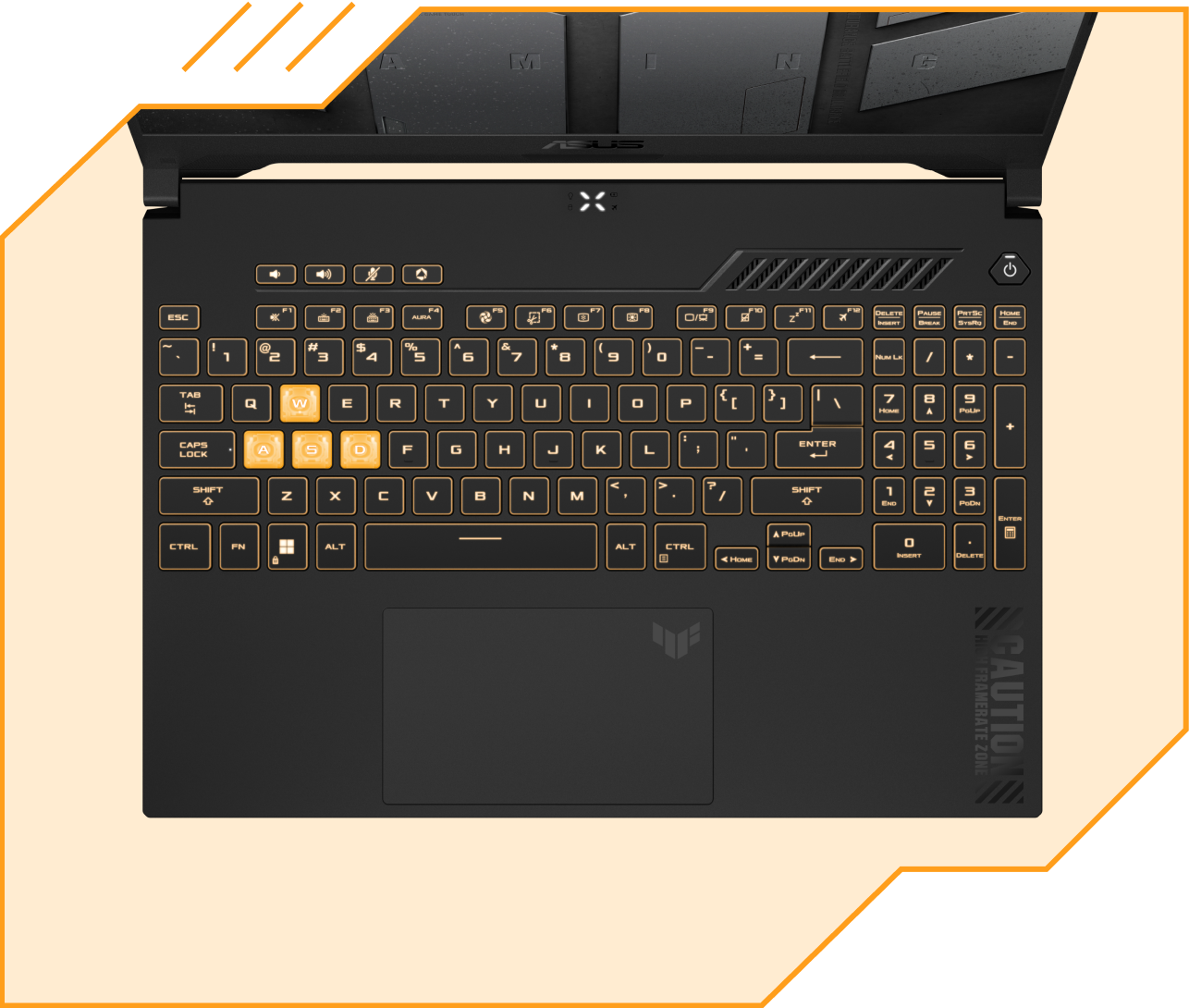 Vue de haut en bas du TUF Gaming F15, avec les touches éclairées en jaune.