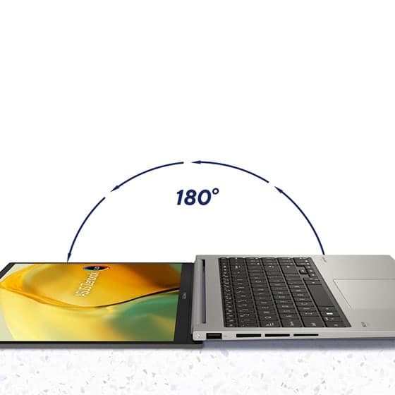 Le couvercle de l'écran d'un ordinateur portable s'ouvre à 180 degrés et repose à plat sur la surface.