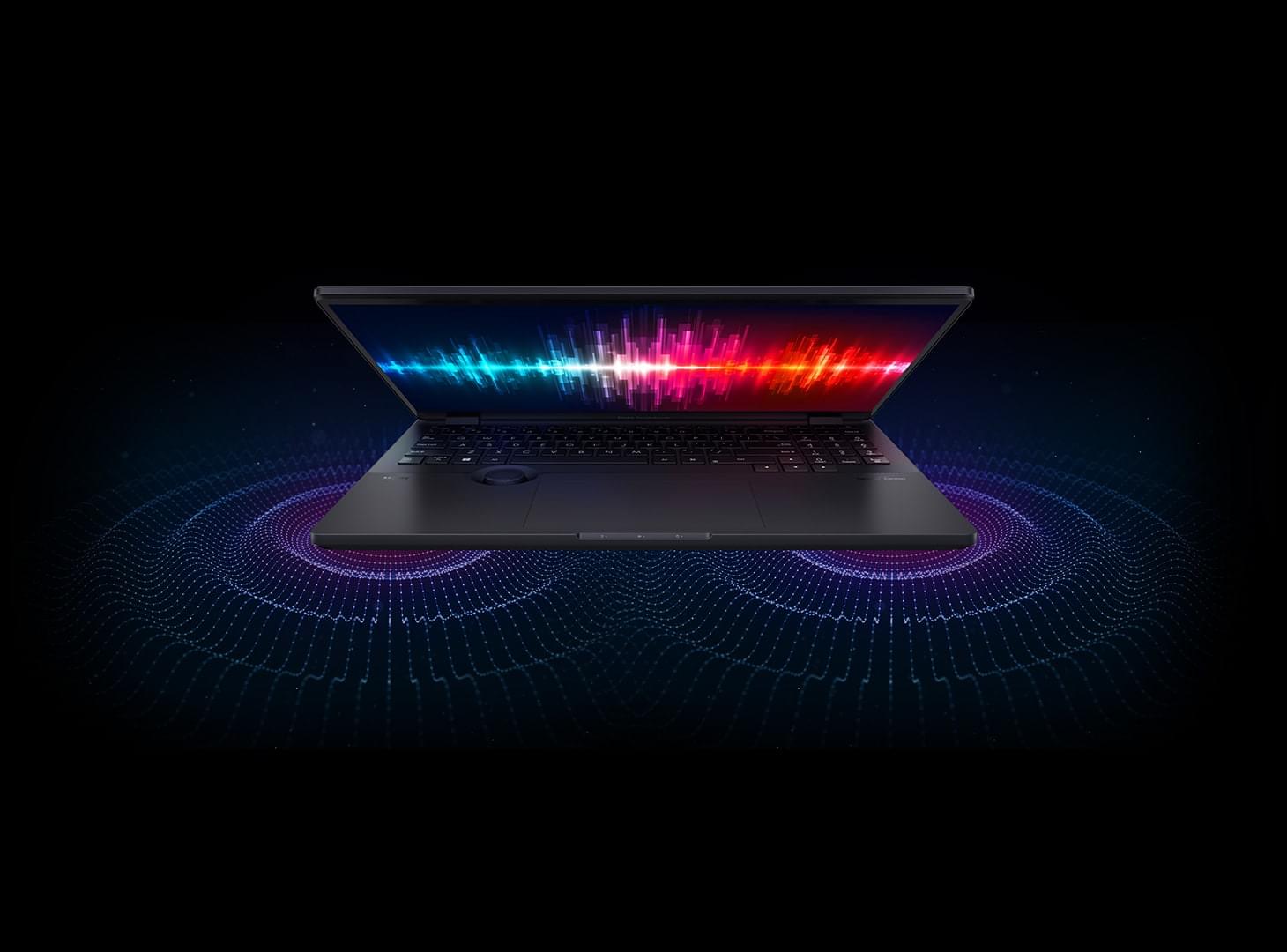 Une vue de face d'un ProArt Studiobook 16 OLED avec des effets visuels acoustiques dans son écran et son environnement.
